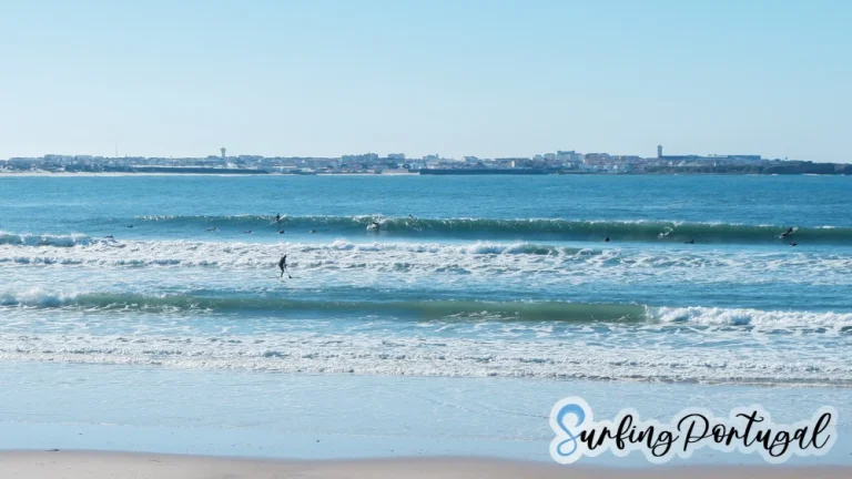 Surfers in the water at Baleal Cantinho