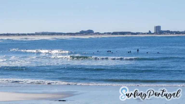 Surfers in the water at Baleal Cantinho