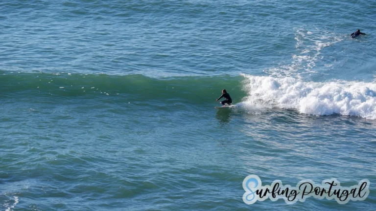 Surfer on a wave at Praia de São Sebastião, Ericeira