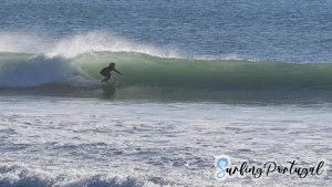 Surfer in a barrel at Supertubos, Peniche