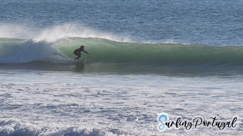 Surfer in a barrel at Supertubos, Peniche