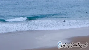 Surfers in the water at Beliche beach