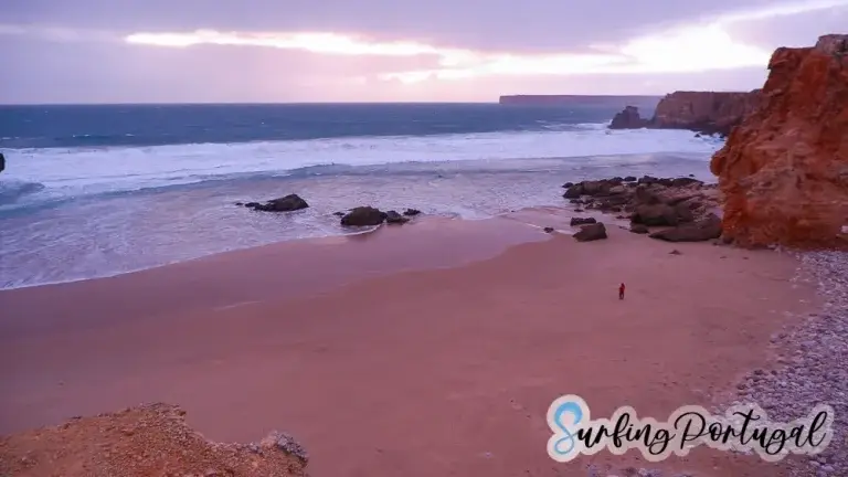 View of the bay of Tonel beach with a person walking on the sand